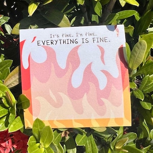 May include: A white card with orange and red flames printed on it. The card has the text "It's fine. I'm fine. EVERYTHING IS FINE." printed on it.