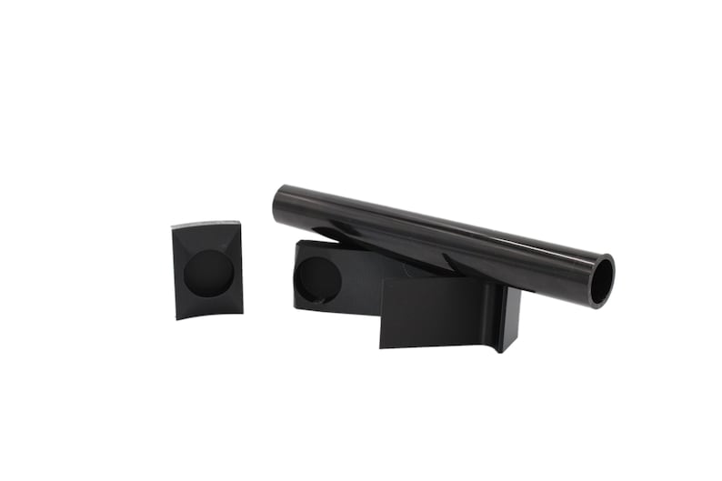May include: A set of three black plastic pipe holders. The holders are designed to hold a pipe in place. The holders are made of a durable plastic and are easy to install.