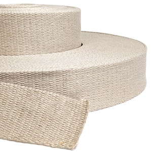 May include: A roll of natural beige woven webbing tape. The tape is rolled up and a section is unrolled to show the texture.