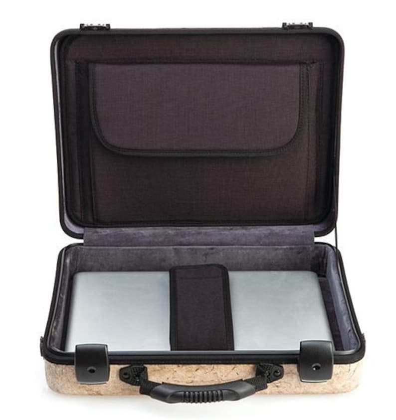 May include: A brown and black laptop case with a cork exterior. The case is open and has a black interior with a padded laptop compartment and a smaller pocket.