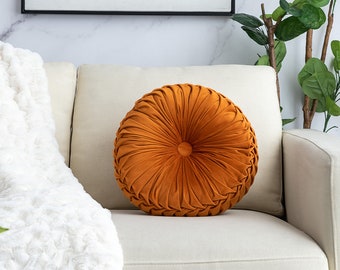 round orange throw pillow
