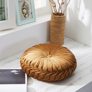 round gold pillows