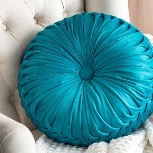 round teal throw pillow
