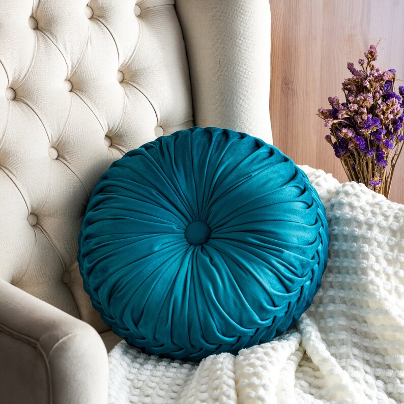 round teal pillow