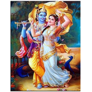 May include: A vibrant painting depicts a couple in traditional Indian attire. The man, with blue skin, plays a flute, while the woman wears a flowing white sari with gold trim. A peacock is visible in the background.