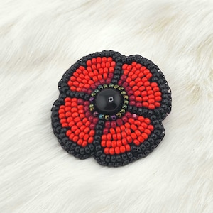 Red beaded Poppy brooch pin for remembrance day veterans day with charlotte sparkle beads | Native owned shop | lapel pin poppy boutonniere