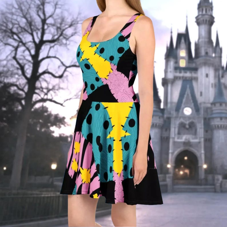 a woman in a colorful dress standing in front of a castle