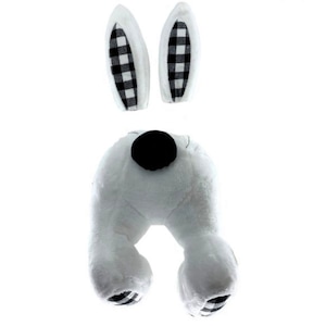 May include: White plush bunny rabbit tail with black and white checkered ears. The bunny tail is a plush toy with a black nose and white fur.