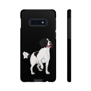May include: Black phone case featuring a white and brown illustration of a Springer Spaniel dog.