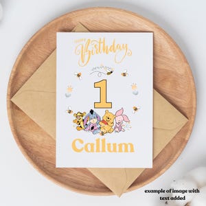 May include: A light blue birthday card with a yellow border and the text "Happy Birthday" in yellow script. The card features a yellow number "1" surrounded by a wreath of yellow flowers and bees.  The characters Winnie the Pooh, Piglet, Tigger, and Eeyore are in the wreath. The name "Callum" is printed in yellow at the bottom of the card.