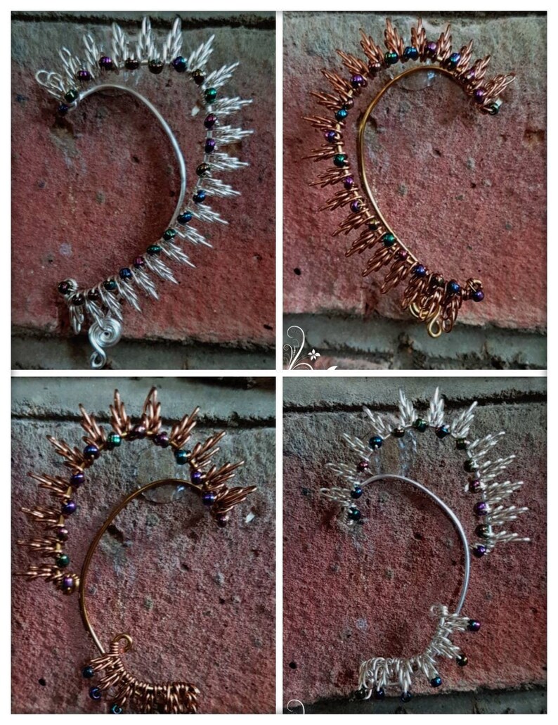 May include: Four ear cuffs made of wire and beads. Two are silver with iridescent beads and two are copper with iridescent beads.