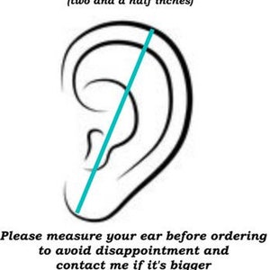 May include: Diagram showing how to measure the length of your ear for an ear cuff. The diagram shows a line drawn from the top of the ear to the bottom of the earlobe, measuring six and a half centimeters (two and a half inches). The text reads: "Please measure your ear before ordering to avoid disappointment and contact me if it's bigger so I can add more wire accordingly."