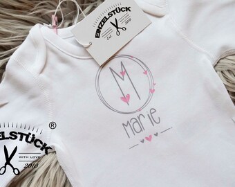 Cute personalized baby bodysuit with monogram and name. Perfect gift for birth or baby shower