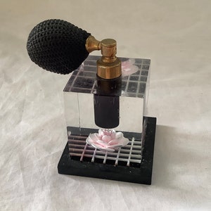 Gorgeous Vintage Hollywood Regency Lucite Acrylic Block Perfume Bottle With Atomizer Embedded Pink Rose on White Grid Black Base Big Glamour