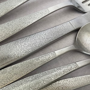 Vintage MONTINA-INDIO Pattern~ 1881 Rogers Stainless Oneida Ltd ~1990s Glossy Textured Foil Flatware Pieces 20th-Century Silverware