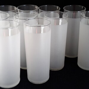 May include: Set of ten frosted glass tumblers. The glasses are clear with a frosted finish and a thin, clear rim.