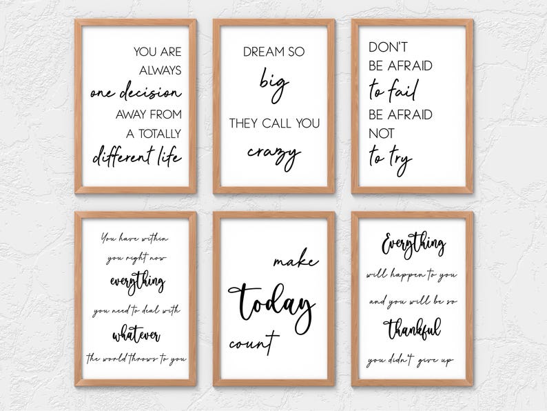 May include: Six framed prints with inspirational quotes in black script on white backgrounds. The frames are a light brown color. The quotes include phrases like "Dream Big" and "Make Today Count."