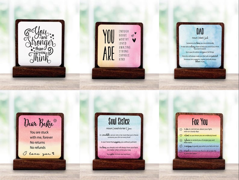 May include: Six wooden desk signs with motivational messages. Each sign has a colourful background and a wooden base. The signs feature phrases such as "You are stronger than you think" and "Soul Sister".
