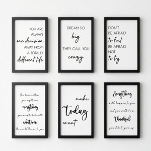 May include: Six framed motivational prints with black frames and white backgrounds. Each print features a different inspirational quote in black script. The quotes include phrases like "Dream Big" and "Make Today Count."