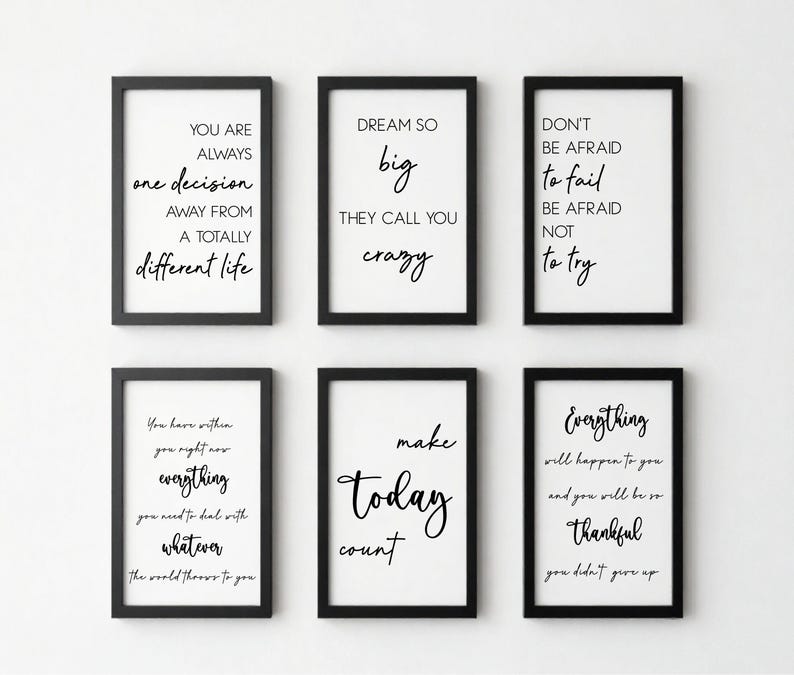 May include: Six framed motivational prints with black frames and white backgrounds. Each print features a different inspirational quote in black script. The quotes include phrases like "Dream Big" and "Make Today Count."