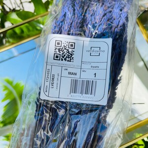 May include: A clear plastic bag containing a bunch of dried lavender flowers. The bag has a label with the text "verdissimo", "PRODUCT OF", "Espa&ntilde;a", "BATCH: 1721/033", "LVE/0820", "Lavander Soft Light", "UM: MAN", "Qty: 1", and a barcode.
