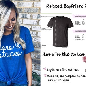 May include: A blue t-shirt with the text "Stars & Stripes" in white. The t-shirt is shown on a model and has a relaxed, boyfriend fit. A size chart is included with measurements in inches and centimeters.