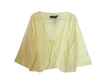Delicate summer open blouse in a light yellow color