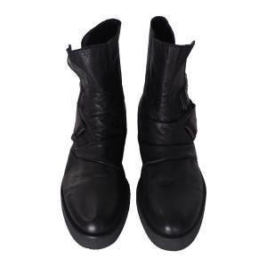May include: A pair of black leather ankle boots featuring a rounded toe, a mid-calf height, and a textured, ruched shaft design. The boots have a thick, solid black platform sole and a smooth finish on the vamp, providing a structured appearance.