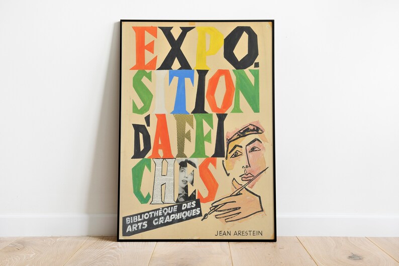 May include: A vintage poster advertising an exhibition of posters. The poster features a colourful, abstract design with the words "EXPO. SITION D'AFFICHES" in bold, colourful letters. The poster is framed in black and has the text "Bibliotheque des Arts Graphiques" and "JEAN ARESTEIN" at the bottom.