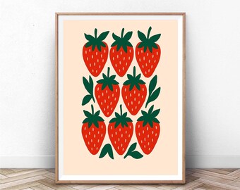 Puede incluir: Lámina artística enmarcada con un patrón repetido de fresas rojas estilizadas con hojas y tallos verdes sobre un fondo melocotón claro. La obra de arte está en un marco de madera, ideal para la decoración de la cocina o el comedor.