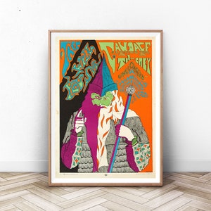 May include: A vintage concert poster featuring a psychedelic illustration of a wizard with a long beard and a staff. The poster is in shades of green, blue, orange, and purple. The text on the poster reads "The Savage  Truth" and "The Grey"