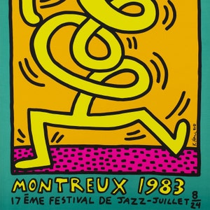 K&ouml;nnte beinhalten: Eine gelbe Figur mit schwarzen Umrissen tanzt auf einem rosa und orangefarbenen Hintergrund. Der Text "MONTREUX 1983" befindet sich am unteren Rand des Bildes. Der Text "17 &egrave;me FESTIVAL DE JAZZ - JUILLET 8" befindet sich unter dem Haupttext.