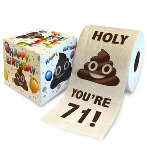 May include: A white toilet paper roll with a brown poop emoji and the text "HOLY YOU'RE 71!" printed on it. The toilet paper is in a cardboard box with a poop emoji and the text "Happy Birthday" printed on it.