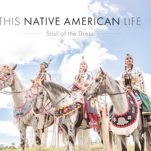 May include: Image features three riders on horseback, adorned in traditional Native American attire. The horses are decorated with colorful tack. The sky is blue with clouds. Text at the top reads "THIS NATIVE AMERICAN LIFE" and "Soul of the Dress" below.