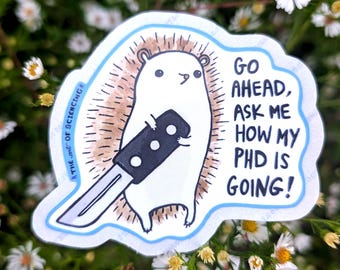 May include: A die-cut sticker featuring a white hedgehog with brown quills holding a black-handled kitchen knife. The text reads: GO AHEAD, ASK ME HOW MY PHD IS GOING! The sticker has a light blue border and includes the text THE ART OF SCIENCING.