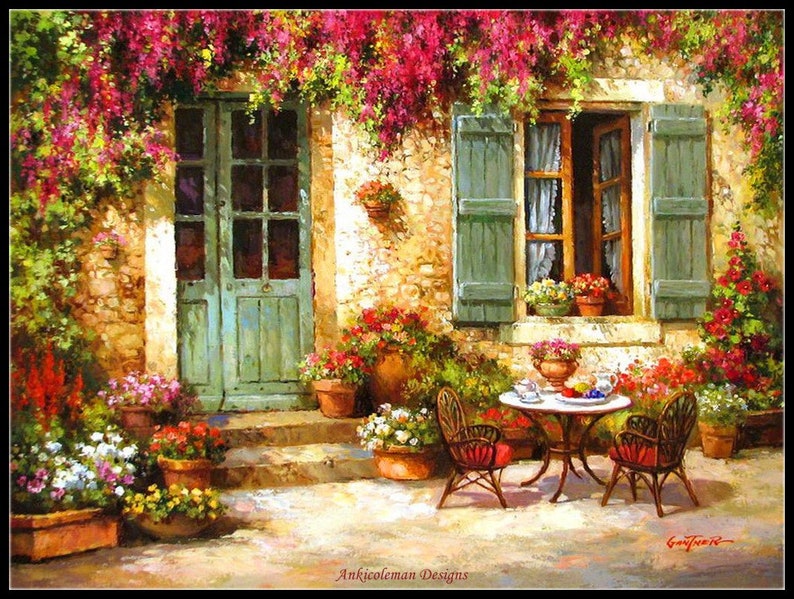 May include: A painting of a stone house with a green door and a window with green shutters. The house is covered in pink flowers and there is a table and chairs on the patio.