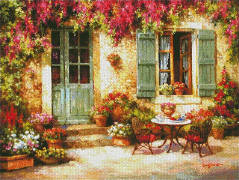 May include: A painting of a quaint cottage with a green door and window, surrounded by lush greenery and flowers. A small table with two chairs sits on the patio, creating a cozy outdoor setting.