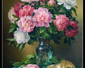 May include: A bouquet of pink and white peonies in a clear glass vase on a blue tablecloth. The flowers are arranged in a vase with a green stem and leaves. The vase is on a blue tablecloth with a white cloth draped over the side.