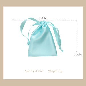 May include: A light blue satin drawstring bag with a 12x15cm size and a weight of 8 grams.  Size: 12x15cm. Weight: 8 g.