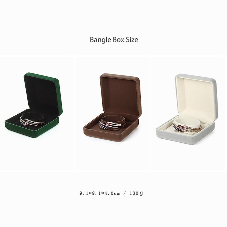 May include: Three square velvet jewelry boxes in green, brown, and gray, each with a bangle inside. The boxes are 9.1 x 9.1 x 4.0 cm and weigh 130 grams.  Bangle Box Size.