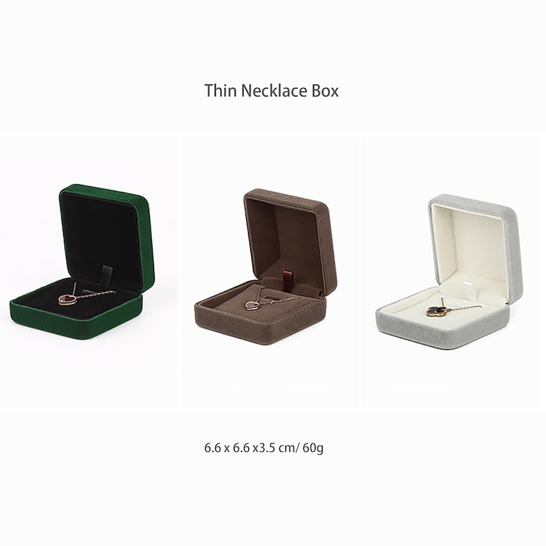 May include: Three velvet jewelry boxes in green, brown, and gray. Each box is open and has a necklace inside. The boxes are 6.6 x 6.6 x 3.5 inches and weigh 60 grams.
