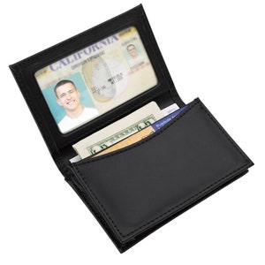 May include: Black leather wallet with a clear ID window, a billfold, and a card slot. The wallet is open and shows a California driver's license inside the window.