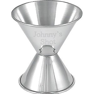 May include: A silver double-ended jigger with the words "Johnny's Shot" engraved on the side.