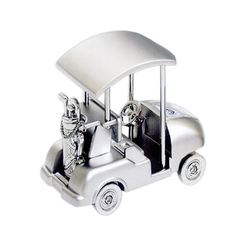 May include: A silver metal golf cart figurine with a golf bag and clubs. The cart has a canopy and a steering wheel.