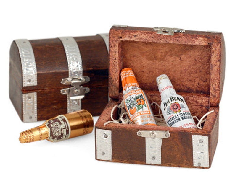 May include: Two miniature chocolate liquor bottles, one Jim Beam and one orange flavored vodka, inside a small wooden treasure chest with silver accents.