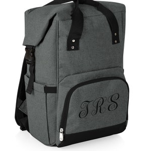 May include: Gray insulated backpack cooler with black straps and a zippered pocket on the front. The pocket has the monogram "JRS" embroidered on it.