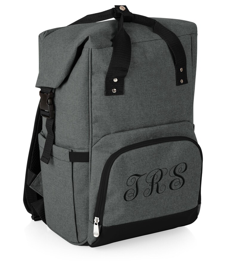 May include: Gray insulated backpack cooler with black straps and a zippered pocket on the front. The pocket has the monogram "JRS" embroidered on it.