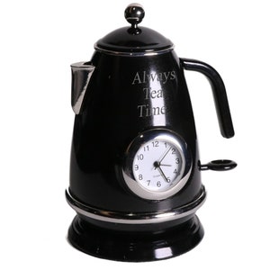 May include: Black electric kettle with a clock face that reads "Always Tea Time".