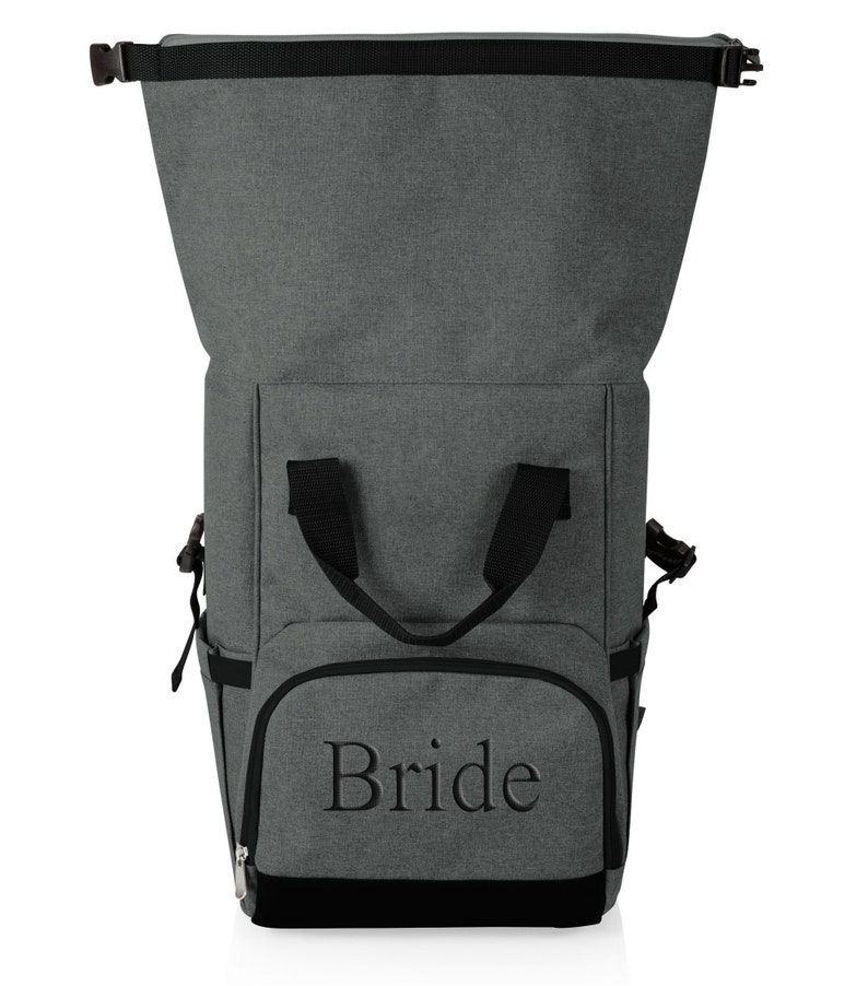 May include: Gray and black insulated backpack with a zippered top and a front pocket that says "Bride".