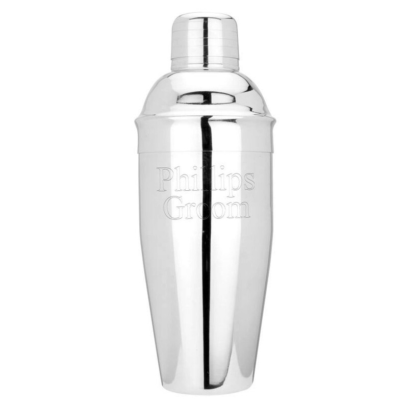 May include: A silver cocktail shaker with the text "Phillips Groom" engraved on the side.